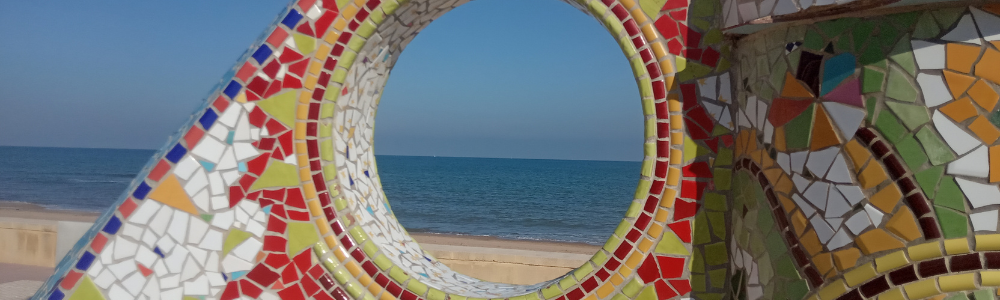 Spain Beach Shot through Sculpture_Telephone Language Service